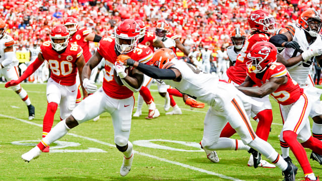 Aug 26, 2023; Kansas City, Missouri, USA; Kansas City Chiefs running back Deneric Prince (34) runs the ball against Cleveland Browns cornerback Gavin Heslop (41) during the second half at GEHA Field at Arrowhead Stadium. Mandatory Credit: Jay Biggerstaff-USA TODAY Sports  